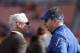 Cleveland Browns owner Jimmy Haslam, left, talks with former Browns coach Rob Chudzinski, now an Indianapolis Colts special assistant, before an NFL football game Sunday, Dec. 7, 2014, in Cleveland. (AP Photo/Tony Dejak)