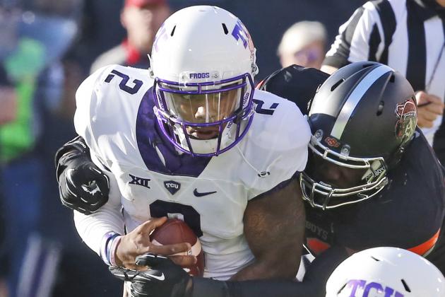 TCU quarterback Trevone Boykin (2) is sacked by Oklahoma State defensive end Jarrell Owens in the second quarter of an NCAA college football game in Stillwater, Okla., Saturday, Nov. 7, 2015. (AP Photo/Sue Ogrocki)