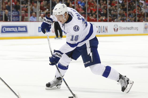 Tampa Bay Lightning left wing Ondrej Palat (18) shoots against the Detroit Red Wings in the third period of an NHL hockey game in Detroit Tuesday, Oct. 13, 2015. (AP Photo/Paul Sancya)