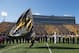 A cheerleader carries the Missouri flag across Faurot Field as the team rushes onto the field before the start of an NCAA college football game against Vanderbilt Saturday, Oct. 25, 2014, in Columbia, Mo. (AP Photo/L.G. Patterson)