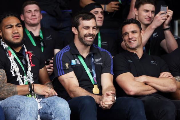 (L-R) All Blacks Ma'a Nonu, Conrad Smith and Dan Carter smile at a parade and official welcome for the rugby team in Auckland on November 4, 2015, following the their Rugby World Cup win against Australia. The New Zealand All Blacks returned to Auckland after they won the Rugby World Cup beating Australia in the final in England. AFP PHOTO / Michael Bradley (Photo credit should read MICHAEL BRADLEY/AFP/Getty Images)