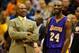 MINNEAPOLIS, MN - DECEMBER 14: Byron Scott of the Los Angeles Lakers speaks with Kobe Bryant #24 during a timeout in the fourth quarter of the game against the Minnesota Timberwolves on December 14, 2014 at Target Center in Minneapolis, Minnesota. The Lakers defeated the Timberwolves 100-94. NOTE TO USER: User expressly acknowledges and agrees that, by downloading and or using this Photograph, user is consenting to the terms and conditions of the Getty Images License Agreement. (Photo by Hannah Foslien/Getty Images)