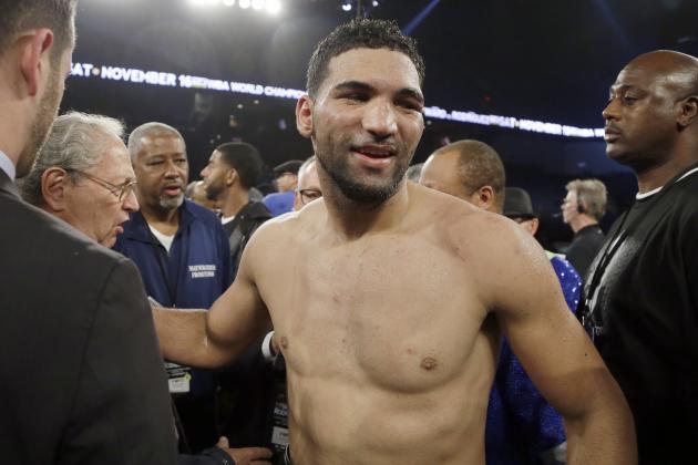 Edwin Rodriguez, of the Dominican Republic, stands with his corner after his loss to Andre Ward in their super middleweight championship boxing match in Ontario, Calif., Saturday, Nov. 16, 2013. Ward won by unanimous decision. (AP Photo/Reed Saxon)