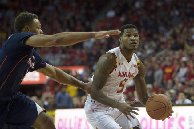 Dec 3, 2014; College Park, MD, USA; Maryland Terrapins guard Dion Wiley (5) looks to shoot as Virginia Cavaliers forward Anthony Gill (13) defends during the first half at Xfinity Center. Mandatory Credit: Tommy Gilligan-USA TODAY Sports