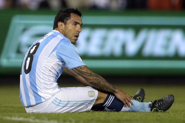 Argentina's forward Carlos Tevez sits on the ground during the Russia 2018 FIFA World Cup South American Qualifiers football match against Paraguay, at the Defensores del Chaco stadium in Asuncion, on October 13, 2015.   AFP PHOTO / JUAN MABROMATA        (Photo credit should read JUAN MABROMATA/AFP/Getty Images)