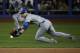 Kansas City Royals second baseman Ben Zobrist fields the ball on a single by New York Mets' Curtis Granderson during the first inning of Game 3 of the Major League Baseball World Series Friday, Oct. 30, 2015, in New York. (AP Photo/Matt Slocum)