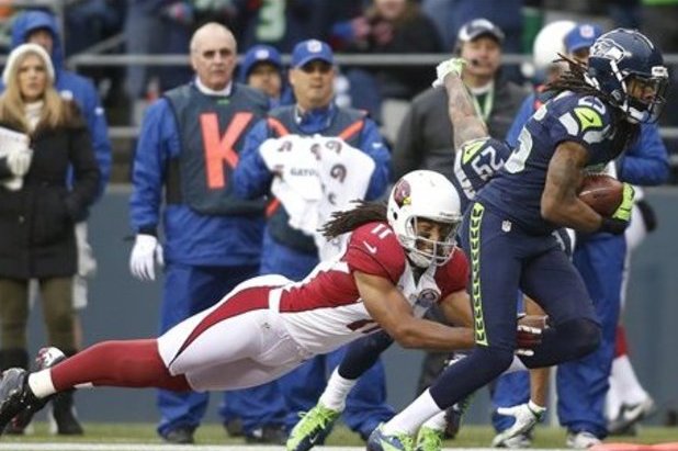 Seattle Seahawks' Richard Sherman, left, greets Arizona Cardinals' Larry  Fitzgerald after an NFL football game Sunday, Dec. 31, 2017, in Seattle.  Arizona won 26-24. (AP Photo/Elaine Thompson Stock Photo - Alamy