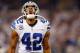 ARLINGTON, TX - JANUARY 04: Strong safety Barry Church #42 of the Dallas Cowboys celebrates after the Cowboys defense forced quarterback Matthew Stafford #9 of the Detroit Lions to fumble the ball late in the fourth quarter during a NFC Wild Card Playoff game at AT&T Stadium on January 4, 2015 in Arlington, Texas. (Photo by Tom Pennington/Getty Images)