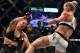 Ronda Rousey of the US (L) goes down after being knocked out by compatriot Holly Holm by a kick to the neck to end the UFC title fight in Melbourne on November 15, 2015. RESTRICTED TO EDITORIAL USE NO ADVERTISING USE NO PROMOTIONAL USE NO MERCHANDISING USE. AFP PHOTO/Paul CROCK (Photo credit should read PAUL CROCK/AFP/Getty Images)