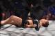 Ronda Rousey of the US hits the canvas after being knocked out by compatriot Holly Holm by a kick to the neck to end the UFC title fight in Melbourne on November 15, 2015. RESTRICTED TO EDITORIAL USE NO ADVERTISING USE NO PROMOTIONAL USE NO MERCHANDISING USE. AFP PHOTO/Paul CROCK (Photo credit should read PAUL CROCK/AFP/Getty Images)