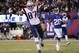 New England Patriots' Rob Gronkowski (87) scores a touchdown in front of New York Giants' Jayron Hosley (28) during the second half of an NFL football game, Sunday Nov. 15, 2015, in East Rutherford, N.J. (AP Photo/Julio Cortez)