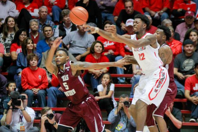 ALBUQUERQUE, NM - NOVEMBER 13: Devon Williams #23 of the New Mexico Lobos passes the ball to a teammate as Tyree Bynum #5 of the Texas Southern Tigers defends during their game at The Wise Pies Arena on November 13, 2015 in Albuquerque, New Mexico. New Mexico won 86-57. (Photo by Aaron Sweet/Getty Images)
