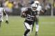 Oakland Raiders running back Taiwan Jones (22) runs toward the end zone to score on a touchdown reception during the second half of an NFL football game against the New York Jets in Oakland, Calif., Sunday, Nov. 1, 2015. (AP Photo/Ben Margot)
