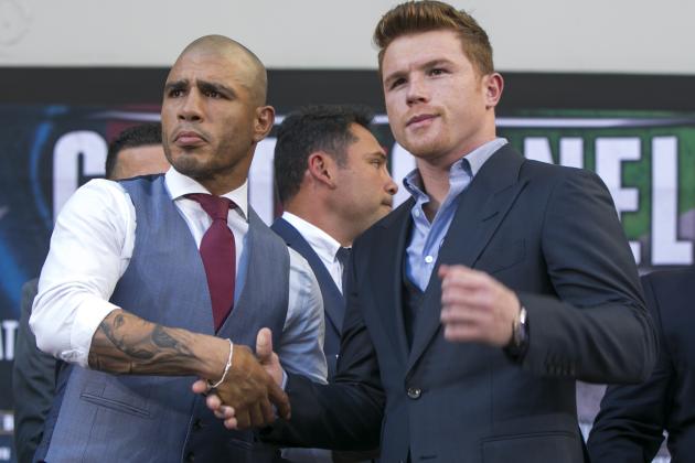 Boxers Miguel Cotto, from Puerto Rico, left, WBC, Ring Magazine and Lineal Middleweight World Champion and Saul