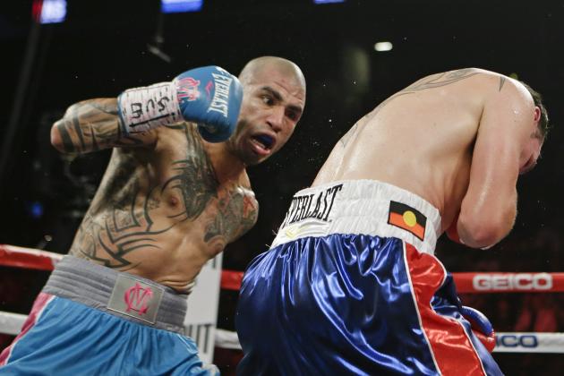 Miguel Cotto, left, of Puerto Rico, punches Daniel Geale, of Australia, during the second round of a boxing match Saturday, June 6, 2015, in New York. (AP Photo/Frank Franklin II)