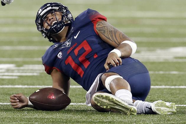 Arizona quarterback Anu Solomon (12) reacts after getting tackled during the first half of an NCAA college football game against Utah, Saturday, Nov. 14, 2015, in Tucson, Ariz. (AP Photo/Rick Scuteri)