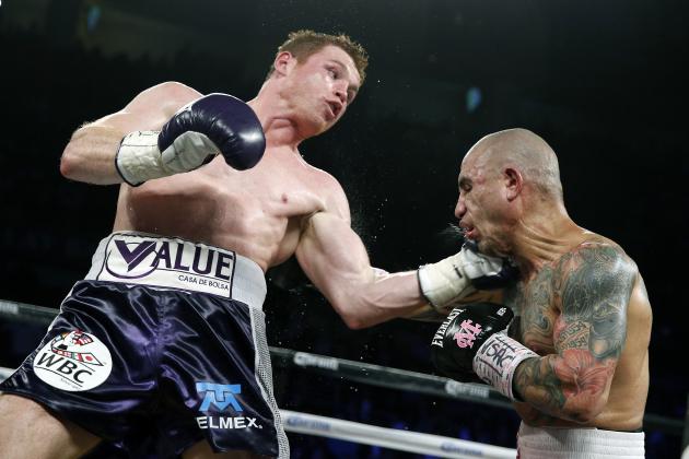 Miguel Cotto, right, of Puerto Rico, get hits by Canelo Alvarez, of Mexico, during a WBC middleweight title bout Saturday, Nov. 21, 2015, in Las Vegas. (AP Photo/John Locher)