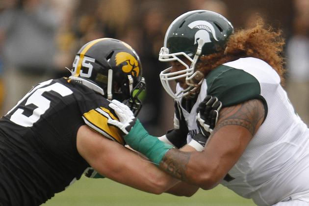 IOWA CITY, IOWA - OCTOBER 5:  Offensive lineman Fou Fonoti #51 of the Michigan State Spartans battles during the second quarter with defensive lineman Drew Ott #95 of the Iowa Hawkeyes on October 5, 2013 at Kinnick Stadium in Iowa City, Iowa. Michigan State won 26-14. (Photo by Matthew Holst/Getty Images)