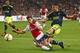 Ajax's Joel Veltman blocks a shot by Fenerbahce’s Robin van Persie, right, during the Europa League group A soccer match between Ajax and Fenerbahce at the ArenA stadium in Amsterdam, Netherlands, Thursday, Nov. 5, 2015. (AP Photo/Peter Dejong)