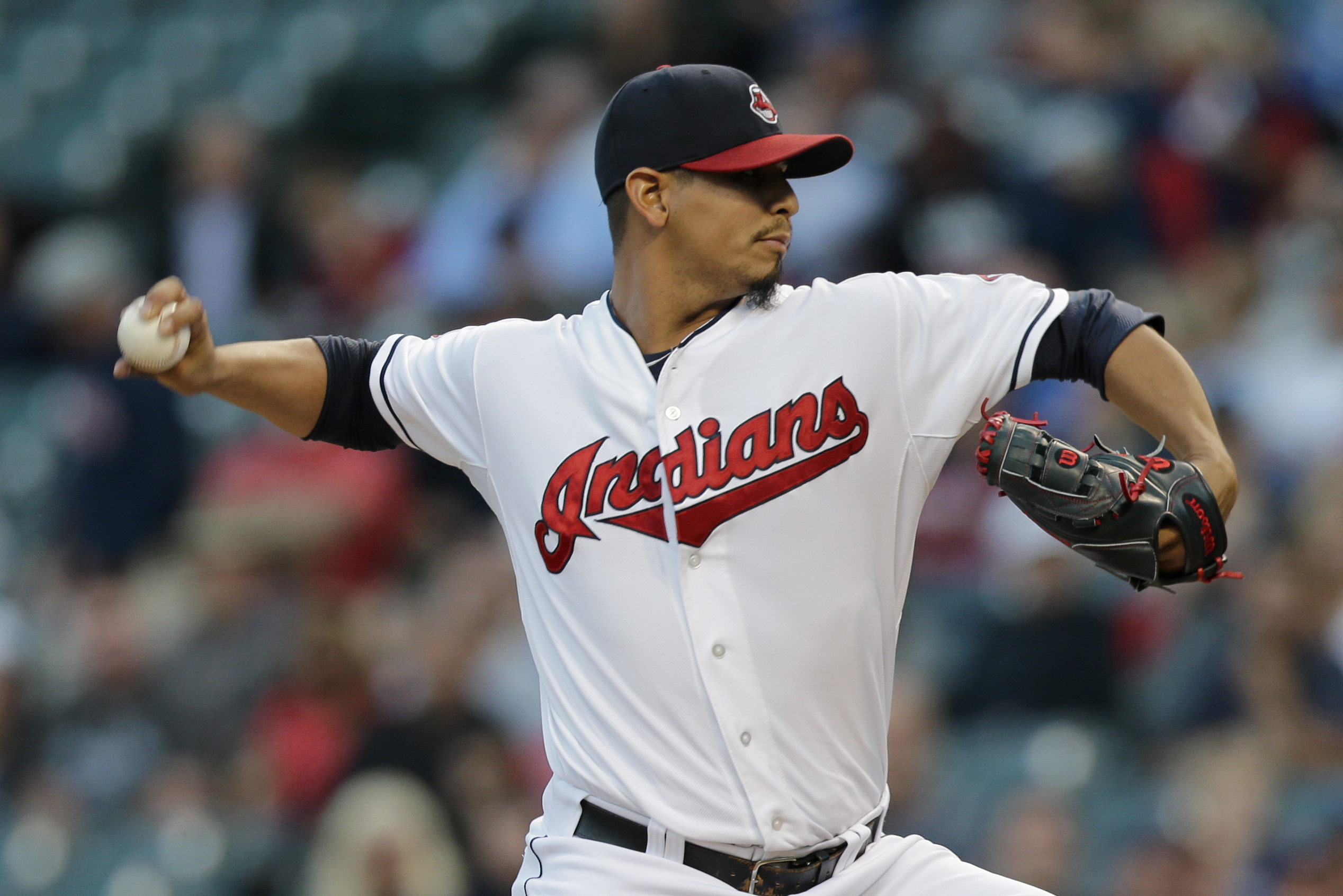 Cleveland Indians pitcher Carlos Carrasco throws live batting