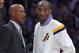 Los Angeles Lakers guard Kobe Bryant, right, talks with head coach Byron Scott during the first half of an NBA basketball game against the Golden State Warriors, Sunday, Nov. 16, 2014, in Los Angeles. (AP Photo/Mark J. Terrill)