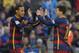 Barcelona's Brazilian forward Neymar (L) celebrates with Barcelona's Argentinian forward Lionel Messi after scoring their third goal during the Spanish league football match FC Barcelona vs Real Sociedad de Futbol at the Camp Nou stadium in Barcelona on November 28, 2015. AFP PHOTO/ LLUIS GENE / AFP / LLUIS GENE (Photo credit should read LLUIS GENE/AFP/Getty Images)
