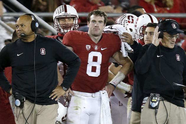 Stanford quarterback Kevin Hogan (8) and head coach David Shaw, left, watches from the sidelines against Oregon during the second half of an NCAA college football game Saturday, Nov. 14, 2015, in Stanford, Calif. Oregon won 38-36. (AP Photo/Tony Avelar)