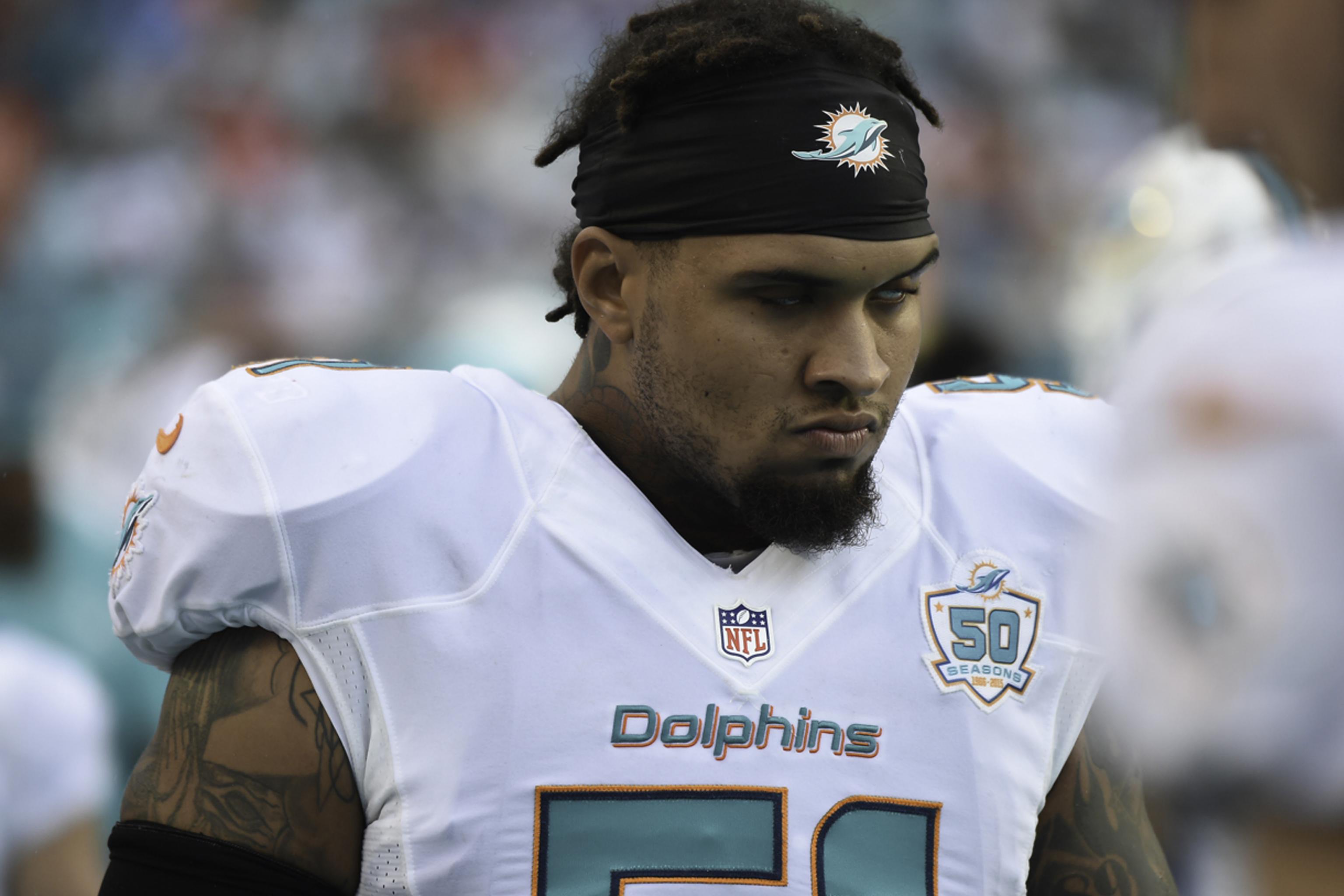 Miami dolphins center mike pouncey hi-res stock photography and