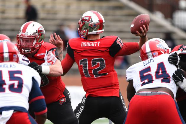Western Kentucky quarterback Brandon Doughty (12) makes a throw against Florida Atlantic during the first half of an NCAA college football game on Saturday, Nov. 7, 2015, at L.T. Smith Stadium in Bowling Green, Ky. (AP Photo/Michael Noble Jr.)