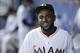 Miami Marlins' Marcell Ozuna is shown as he walks in the dugout before the start of a baseball game against the Chicago Cubs, Monday, June 1, 2015, in Miami. (AP Photo/Wilfredo Lee)