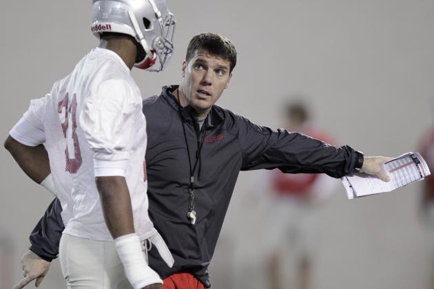 FILE - This March 4, 2014 file photo shows Ohio State's new co-defensive coordinator and safeties coach Chris Ash instructing defensive back Tyvis Powell during their Spring NCAA college football practice, in Columbus, Ohio. A lot of the early preseason publications and websites figure Ohio State should have one of the top 10 or 15 teams in the country. If the Buckeyes live up to that hype, it’ll likely be because of a lot of players who are unknown to even staunch fans. (AP Photo/Jay LaPrete, File)