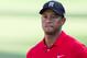 Tiger Woods watches a chip shot to the 15th green during the final round of the Wyndham Championship golf tournament at Sedgefield Country Club in Greensboro, N.C., Sunday, Aug. 23, 2015. (AP Photo/Rob Brown)