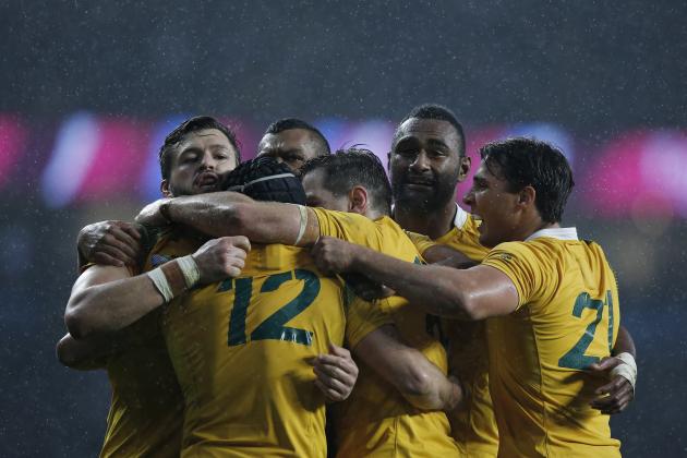 Australia's wing Adam Ashley-Cooper (L) and Australia's centre Tevita Kuridrani (2nd R) celebrate with teammates after winning a quarter final match of the 2015 Rugby World Cup between Australia and Scotland at Twickenham stadium, southwest London, on October 18, 2015. AFP PHOTO / ADRIAN DENNIS
RESTRICTED TO EDITORIAL USE, NO USE IN LIVE MATCH TRACKING SERVICES, TO BE USED AS NON-SEQUENTIAL STILLS (Photo credit should read ADRIAN DENNIS/AFP/Getty Images)