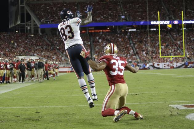 Chicago Bears tight end Martellus Bennett (83) catches a 3-yard touchdown in front of San Francisco 49ers safety Eric Reid (35) during the fourth quarter of an NFL football game in Santa Clara, Calif., Sunday, Sept. 14, 2014. (AP Photo/Marcio Jose Sanchez)