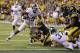 Michigan State's LJ Scott (3) runs for a 1-yard touchdown during the second half of the Big Ten championship NCAA college football game against Iowa, Saturday, Dec. 5, 2015, in Indianapolis. Michigan State won 16-13. (AP Photo/Michael Conroy)
