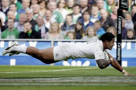FILE - In this Aug. 27, 2011 file photo England's Manu Tuilagi scores a try against Ireland during their Rugby Union International game in Dublin, Ireland. Tuilagi is the youngest of six brothers from the Samoan village of Fatausi-Fogapoa to have played for the Leicester Tigers and has decided his international future lies with England and made an early impression, working his way through age groups into England's World Cup squad. (AP Photo/Peter Morrison)