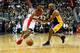 WASHINGTON, DC - DECEMBER 02: John Wall #2 of the Washington Wizards drives to the basket while being guarded by Kobe Bryant #24 of the Los Angeles Lakers in the second half at Verizon Center on December 2, 2015 in Washington, DC. NOTE TO USER: User expressly acknowledges and agrees that, by downloading and or using this photograph, User is consenting to the terms and conditions of the Getty Images License Agreement. (Photo by Rob Carr/Getty Images)