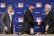 Switch-hitting free agent Ben Zobrist, center, shakes hands with Chicago Cubs manager Joe Maddon, right, at Major League Baseball's winter meetings where it was announced that Zobrist has signed with the Cubs Wednesday, Dec. 9, 2015, in Nashville, Tenn. At left is Cubs general manager Jed Hoyer. (AP Photo/Mark Humphrey)