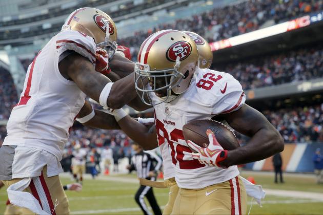 San Francisco 49ers wide receiver Torrey Smith (82) celebrates a game winning touchdown with his teammates during the overtime of an NFL football game against the Chicago Bears, Sunday, Dec. 6, 2015, in Chicago. The 49ers won 26-20. (AP Photo/Charles Rex Arbogast)