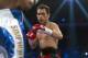Simpiwe Vetyeka of South Africa and Nonito Donaire (C) of the Philippines during their WBA featherweight title boxing match in Macau on May 31, 2014. Donaire won the fight. AFP PHOTO / ANTHONY WALLACE (Photo credit should read ANTHONY WALLACE/AFP/Getty Images)