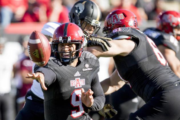 Arkansas State quarterback Fredi Knighten (9) pitches the ball during the first half of an NCAA college football game against Texas State Saturday, Dec. 5, 2015, in Jonesboro, Ark. (AP Photo/Gareth Patterson)