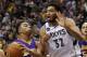 Los Angeles Lakers guard D'Angelo Russell (1) goes to the basket against Minnesota Timberwolves center Karl-Anthony Towns (32) during the second half of an NBA basketball game in Minneapolis, Wednesday, Dec. 9, 2015. The Timberwolves won 123-122 in overtime. (AP Photo/Ann Heisenfelt)