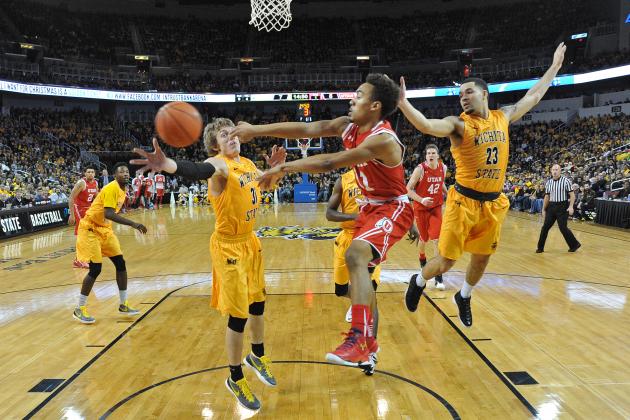 WICHITA, KS - DECEMBER 12:  Guard Brandon Taylor #11 of the Utah Utes passes the ball between defenders Fred VanVleet #23 and Ron Baker #31 of the Wichita State Shockers during the first half on December 12, 2015 at Intrust Bank Arena in Wichita, Kansas.  Wichita State defeated Utah 67-50. (Photo by Peter Aiken/Getty Images)