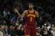 Cleveland Cavaliers guard Kyrie Irving (2) signals against the Detroit Pistons in the first half of an NBA basketball game in Auburn Hills, Mich., Tuesday, Jan. 27, 2015. (AP Photo/Paul Sancya)