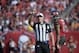 Referee Ed Hochuli announces a penalty on the field during the first half of an NFL football game between the Tampa Bay Buccaneers and the Atlanta Falcons in Tampa, Fla., Sunday, Dec. 6, 2015. (AP Photo/Phelan M. Ebenhack)