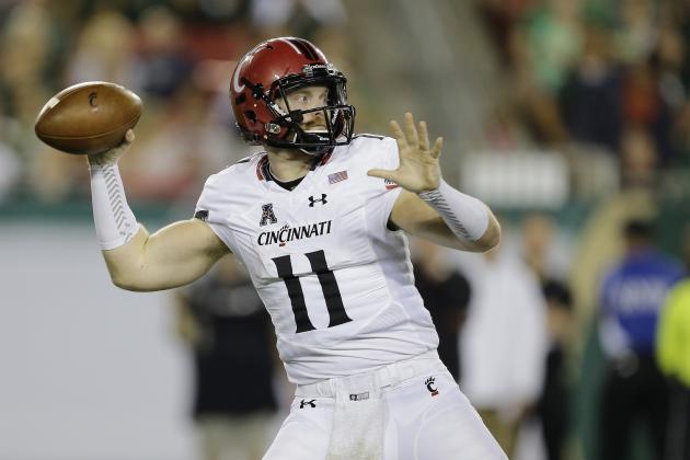 Cincinnati quarterback Gunner Kiel (11) throws a pass against South Florida during the first quarter of an NCAA college football game Friday, Nov. 20, 2015, in Tampa, Fla. (AP Photo/Chris O'Meara)