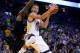 OAKLAND, CA - DECEMBER 16: Stephen Curry #30 of the Golden State Warriors goes up for a shot against Eric Bledsoe #2 of the Phoenix Suns at ORACLE Arena on December 16, 2015 in Oakland, California. NOTE TO USER: User expressly acknowledges and agrees that, by downloading and or using this photograph, User is consenting to the terms and conditions of the Getty Images License Agreement. (Photo by Ezra Shaw/Getty Images)