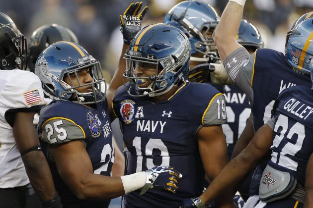 Navy's Keenan Reynolds (19) celebrates a touchdown against Army during an NCAA college football game Saturday, Dec. 12, 2015, in Philadelphia. (AP Photo/Matt Slocum)