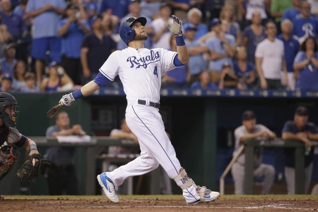 Kansas City Royals' Alex Gordon hits a sacrifice fly to score Eric Hosmer during the second inning of a baseball game against the Detroit Tigers Tuesday, Sept. 1, 2015, in Kansas City, Mo. (AP Photo/Charlie Riedel)