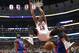 Chicago Bulls center Joakim Noah (13) dunks between Detroit Pistons guard Reggie Jackson (1) and Anthony Tolliver (43) during the first half of an NBA basketball game Friday, Dec. 18, 2015, in Chicago. (AP Photo/Charles Rex Arbogast)